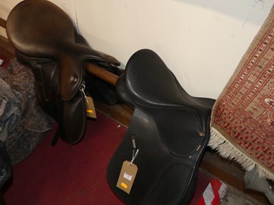 Lot 1149 - A tan leather horse's saddle by WOW; together...