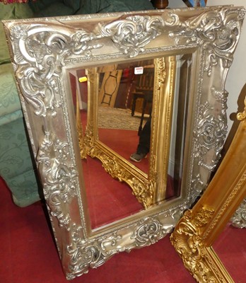 Lot 1155 - A contemporary silvered floral decorated...