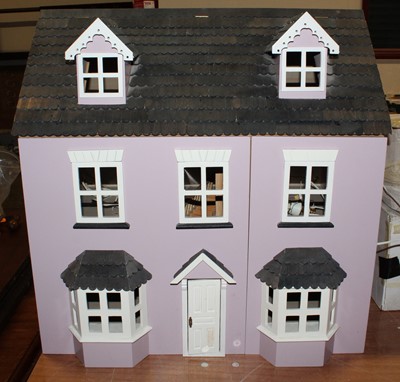 Lot 1632 - A modern wooden dolls house with opening front...