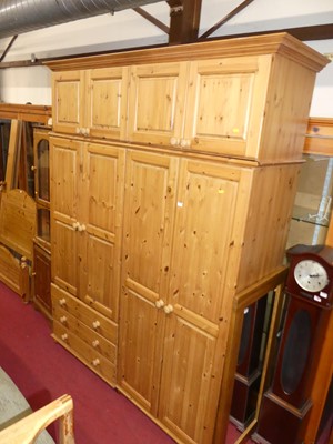 Lot 1164 - A large contemporary pine wardrobe, w.174cm