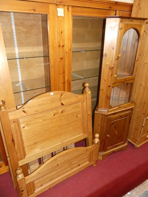 Lot 1165 - A modern pine single bed, having side rails...