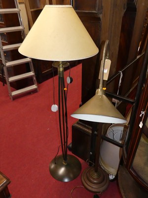Lot 1168 - A contemporary brass floor light, having...