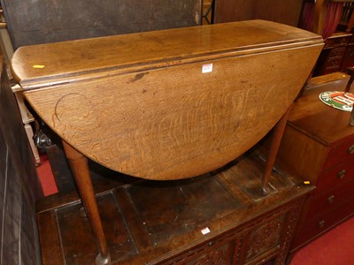 Lot 1175 - An early 19th century oak padfoot dropleaf...