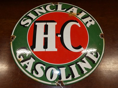 Lot 1178 - An enamel on metal circular convex advertising...