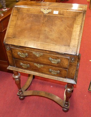 Lot 1180 - A figured walnut, cross and feather banded...