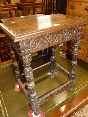 Lot 1181 - A joined oak and chip carved joint stool,...