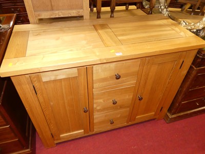 Lot 1186 - A contemporary light oak sideboard, w.110cm