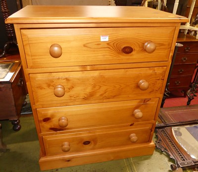 Lot 1187 - A contemporary pine chest of four long drawers,...