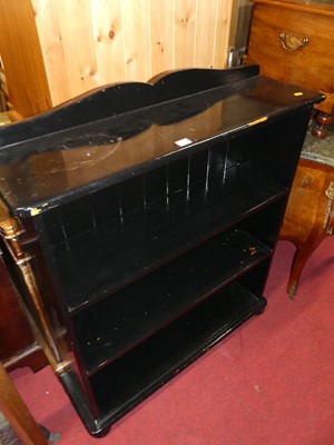 Lot 1199 - A black painted freestanding low open...