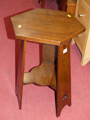 Lot 1220 - An Arts & Crafts oak hexagonal occasional...