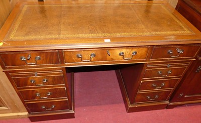 Lot 1223 - A reproduction mahogany and gilt tooled brown...