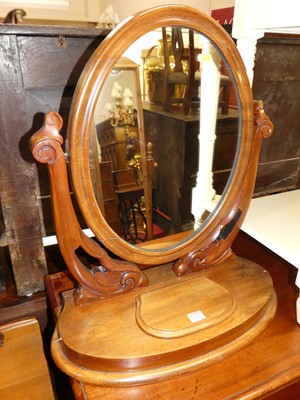 Lot 1229 - A mid-Victorian mahogany oval swing dressing...
