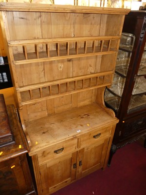 Lot 1236 - A rustic pine one-piece kitchen dresser, the...