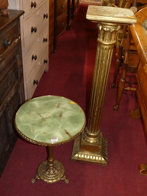 Lot 1239 - A gilt fluted square pedestal plant stand,...
