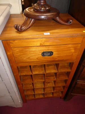 Lot 1245 - A contemporary teak freestanding wine rack,...