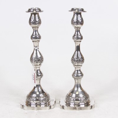 Lot 253 - A pair of George V silver table candlesticks,...