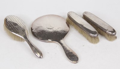 Lot 265 - A George V silver backed hand mirror, with...