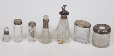 Lot 266 - A collection of assorted silver topped...