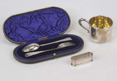 Lot 267 - A sterling silver mug engraved RAJC; together...
