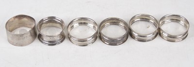 Lot 278 - A set of four George V silver napkin rings;...