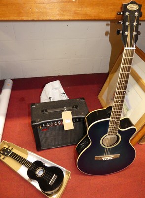 Lot 1092 - A Stagg acoustic guitar in canvas case,...