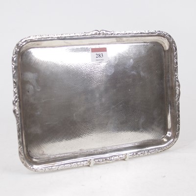 Lot 283 - A George V silver dressing table tray, of...