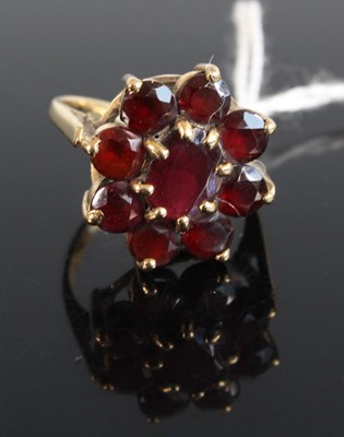 Lot 344 - A modern 9ct gold and garnet set flower head...