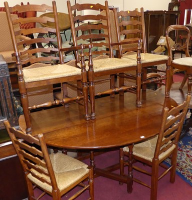 Lot 1254 - A joined cherrywood dining suite comprising;...