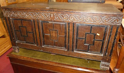 Lot 1256 - An 18th century oak three-panelled hinge top...
