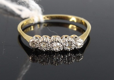 Lot 365 - An 18ct gold platinum and diamond five stone...