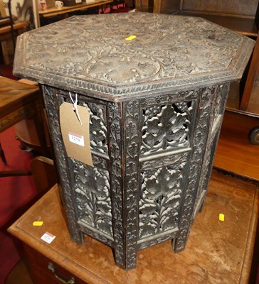 Lot 1270 - An early 20th century Indian ebonised relief...
