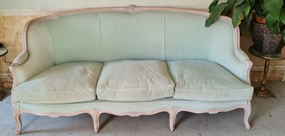 Lot 1275 - A French limed beech framed three-seater sofa,...