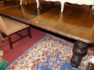 Lot 1278 - An early 20th century heavily carved oak round...