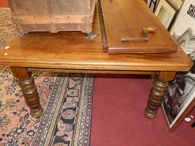 Lot 1285 - An Edwardian walnut extending dining table,...