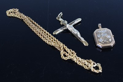 Lot 382 - A modern 9ct gold crucifix pendant, h.45mm;...