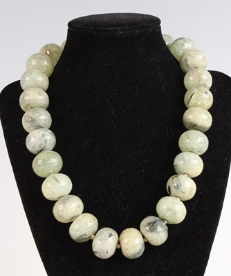 Lot 390 - A beaded and polished prehnite necklace, with...