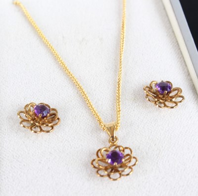 Lot 403 - A modern 9ct gold amethyst set flower head...