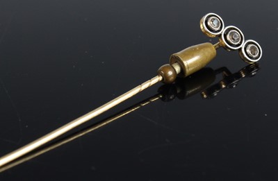 Lot 408 - A Victorian yellow metal diamond set tie-pin,...