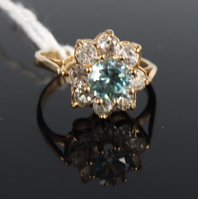 Lot 412 - A yellow metal and paste set dress ring as a...