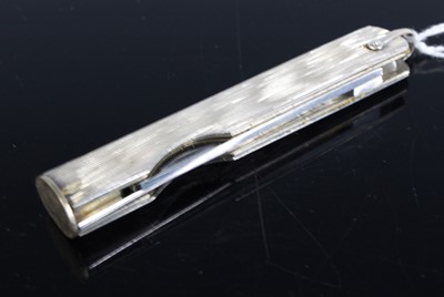Lot 414 - A silver pocket pipe-tamper, with twin hinged...
