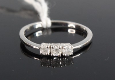 Lot 415 - A modern platinum and diamond set three-stone...