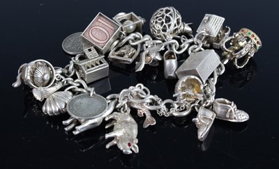 Lot 417 - A silver curblink bracelet containing a large...