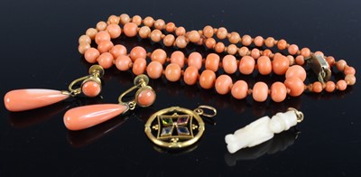 Lot 418 - A beaded and graduated coral knotted single...
