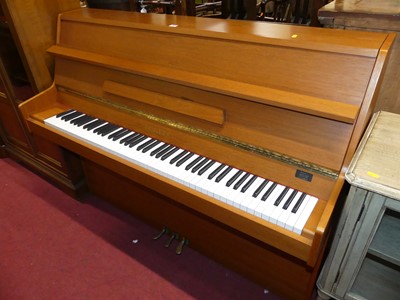 Lot 1337 - A 1970s teak cased upright piano by Rogers,...