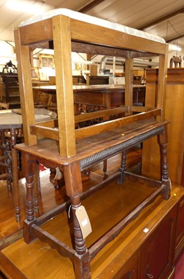 Lot 1339 - A joined oak long bench stool, raised on...