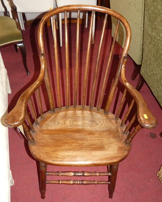 Lot 1302 - A stained oak and bentwood stickback elbow...