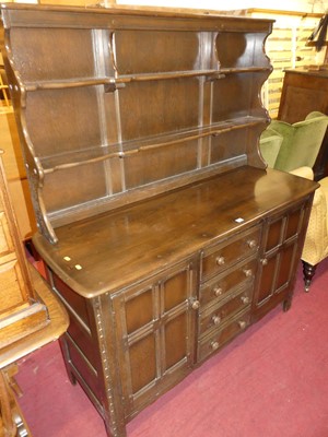 Lot 1346 - An Ercol dark elm dresser, w.146cm