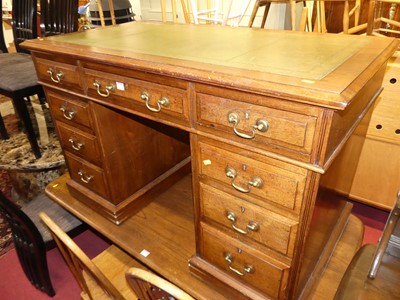 Lot 1347 - A circa 1900 walnut and gilt tooled green...
