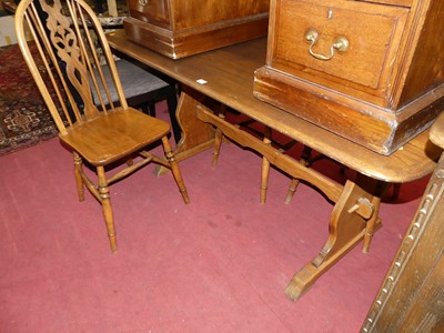 Lot 1348 - An Ercol dark elm dining table, length 150cm;...