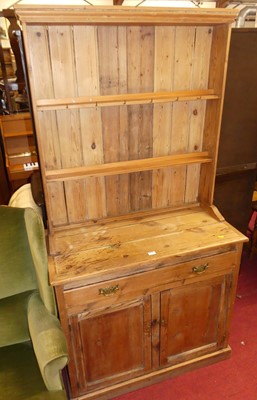 Lot 1350 - A rustic pine narrow kitchen dresser, w.91.5cm